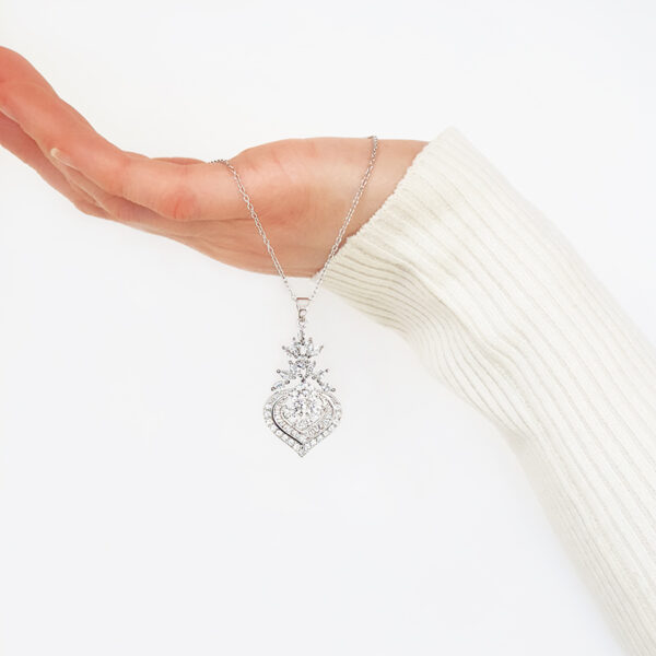 A dramatic style, Paisley is has pristine baguettes placed meticulously in a smooth silky silver finish with shimmering cubic zirconias surrounding this stunning design.