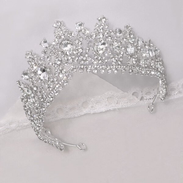 A beautiful crystal crown with crystal embellishment for a sparkling regal look. A bride to be feeling like a queen on her wedding day.
