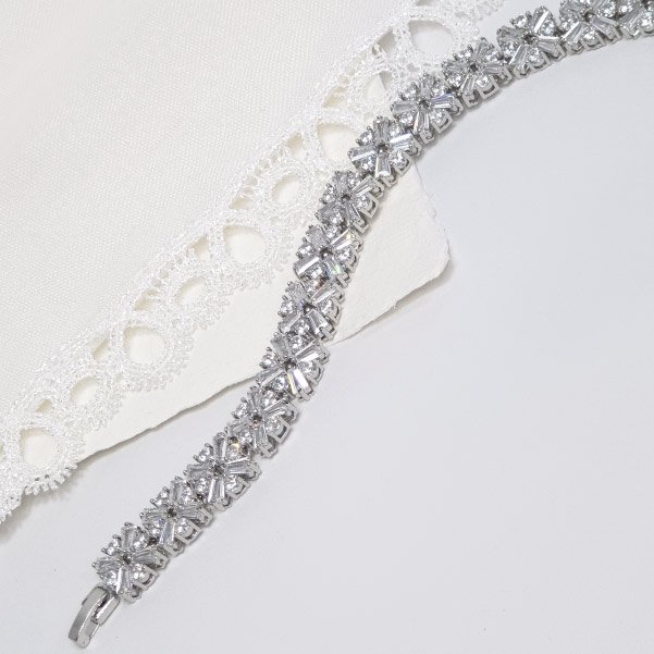 Baguette zircon bracelet with a bold placement of crystals diagonally aligned in clusters along the entire length.