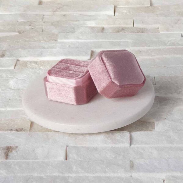 Wedding ring box in a square shape made of soft velvet.