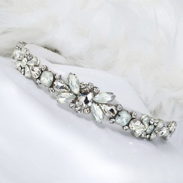 Embellished with luxe blue opal opaque crystals, precious high quality crystals and pops of sparkling Swarovski elements, this simple yet glistening piece offers a casual elegance.